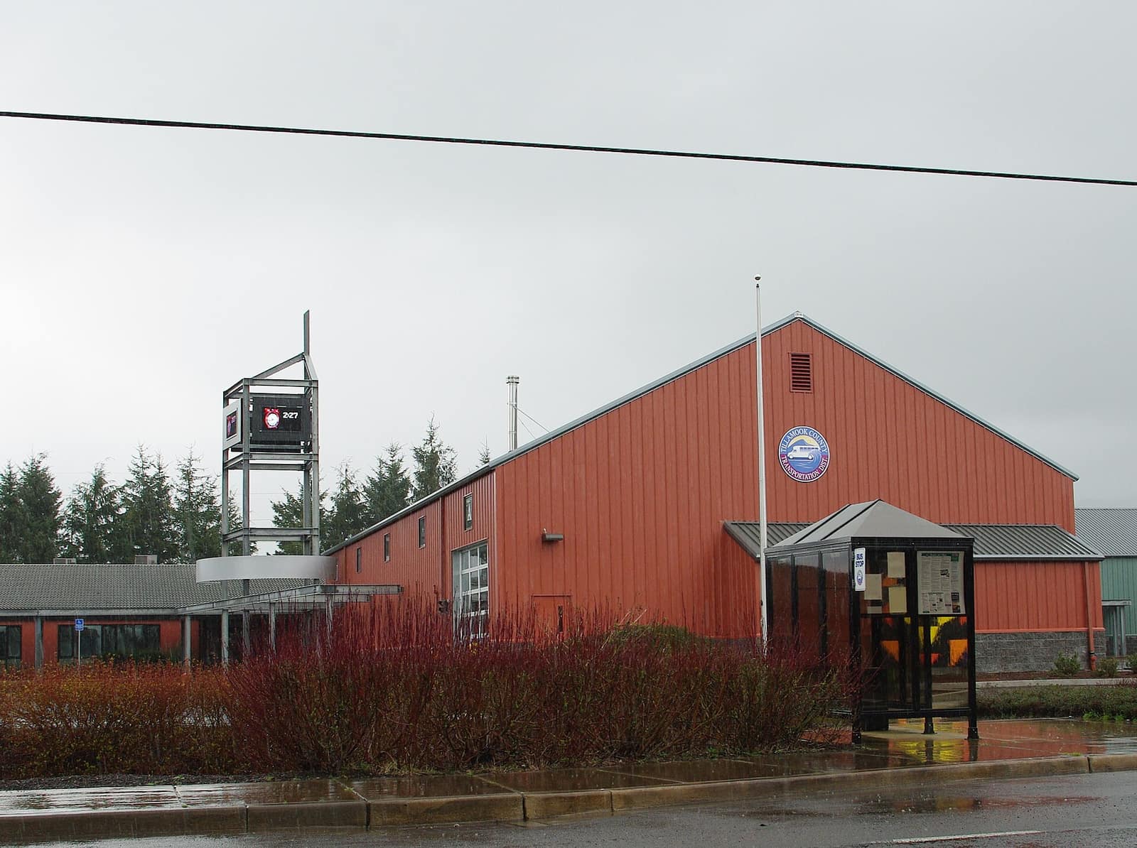 The Tillamook County Transportation District building with a bus shelter in the foreground